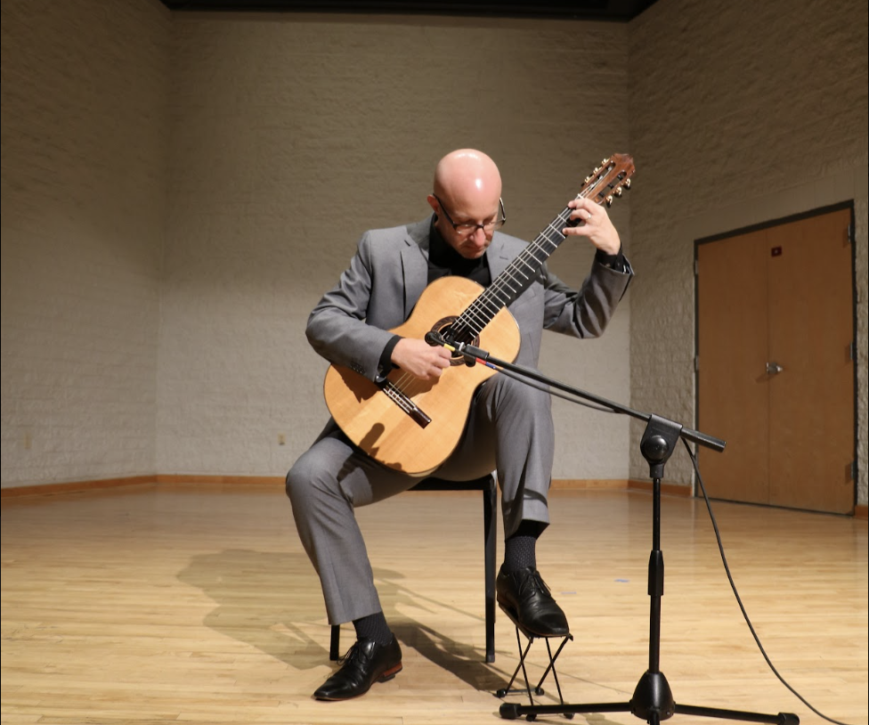 Photo of Michael Lich playing guitar in the Recital Hall.