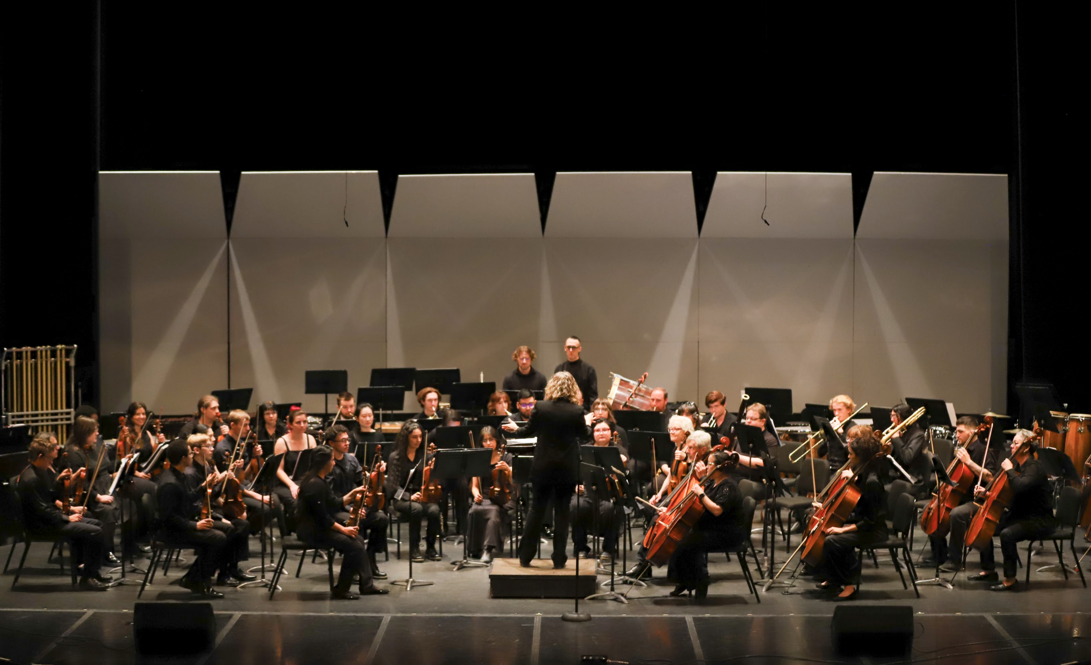 Photo of Dr. Anne Grimes conducting the PCC Symphonic Orchestra in the Proscenium Theatre