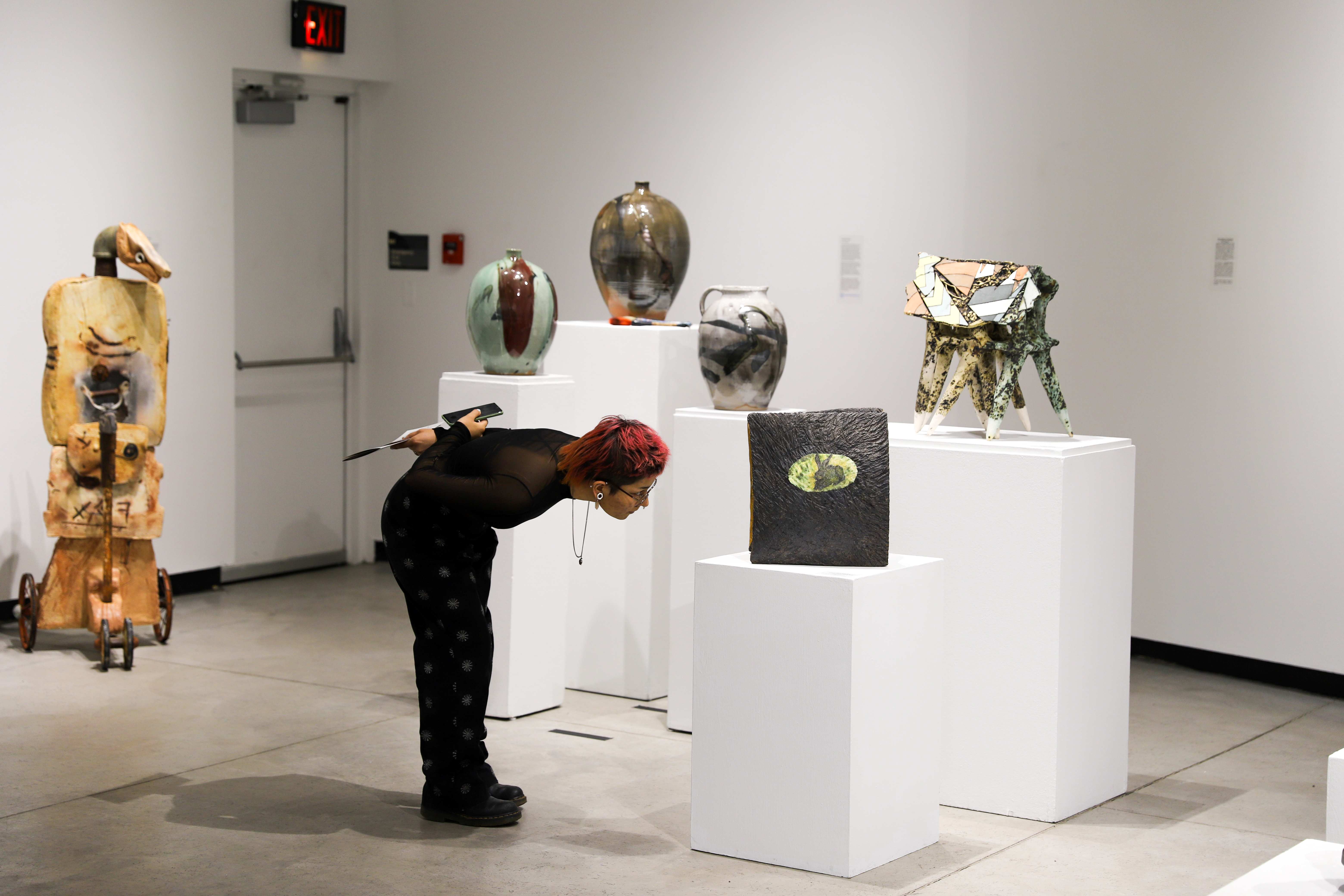a guest examining a sculpture