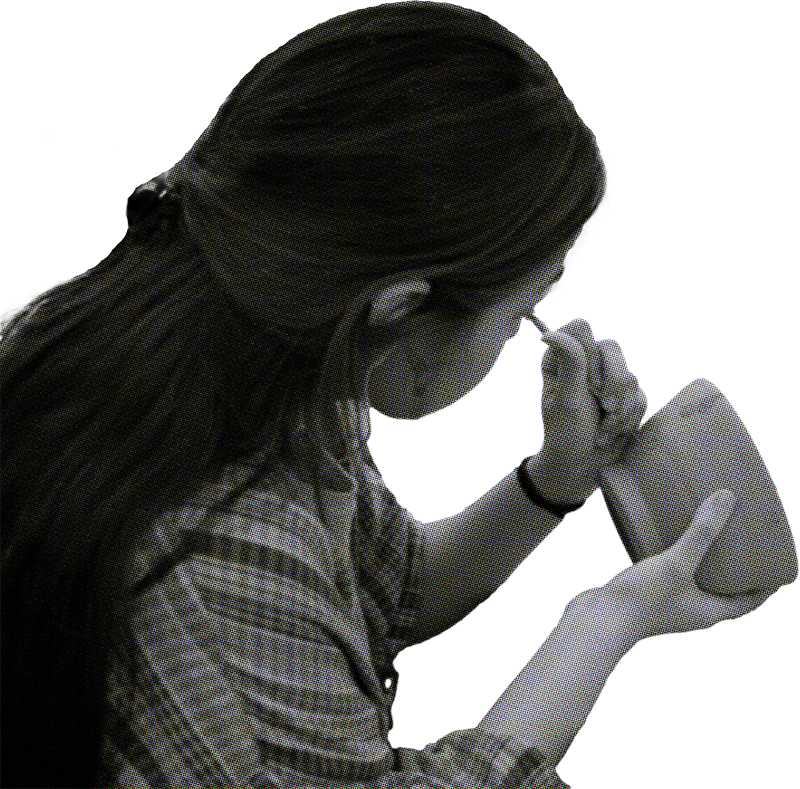 A Student putting on final touches on a piece of pottery