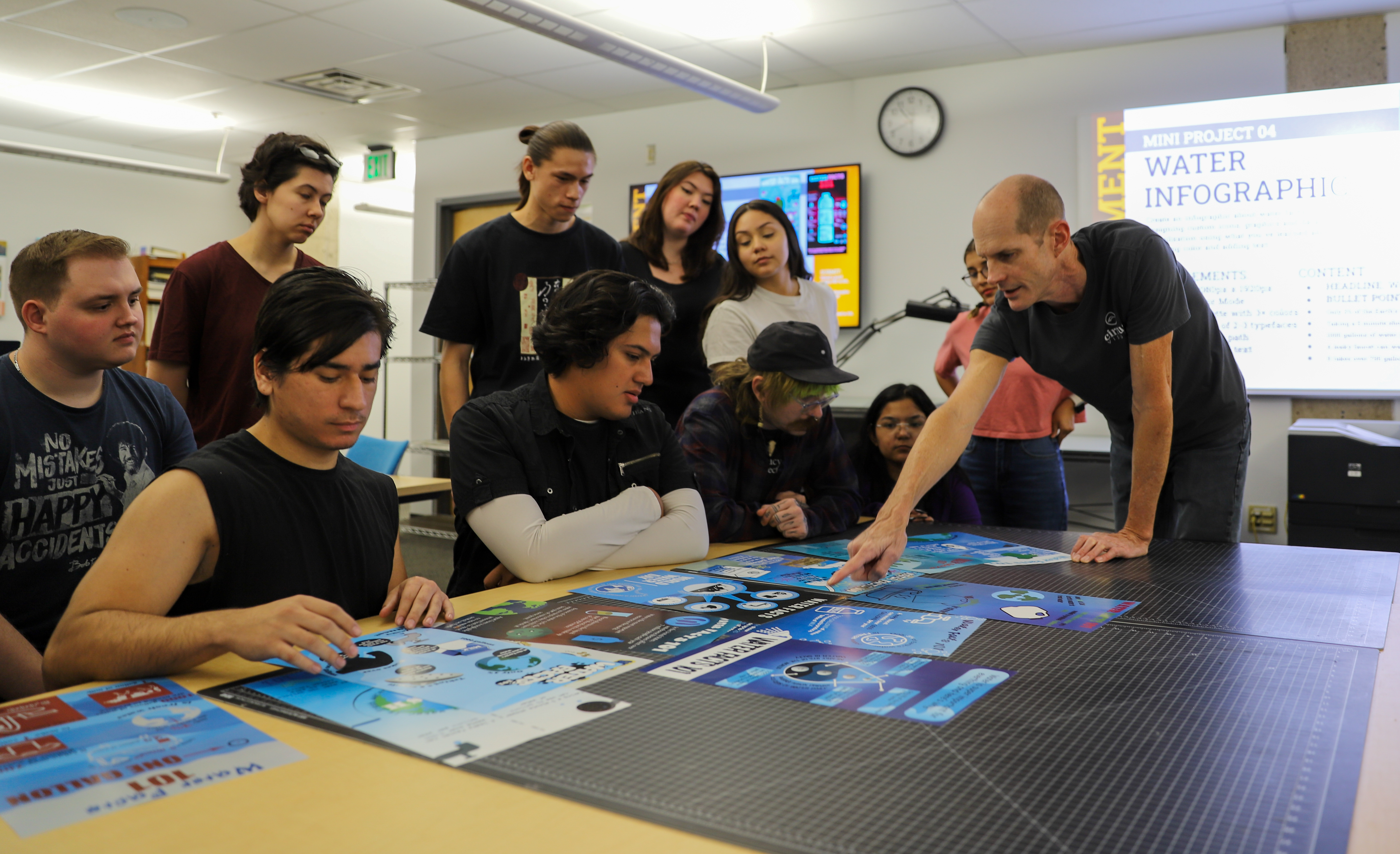 Faculty member Chris Carls leads students in a critique