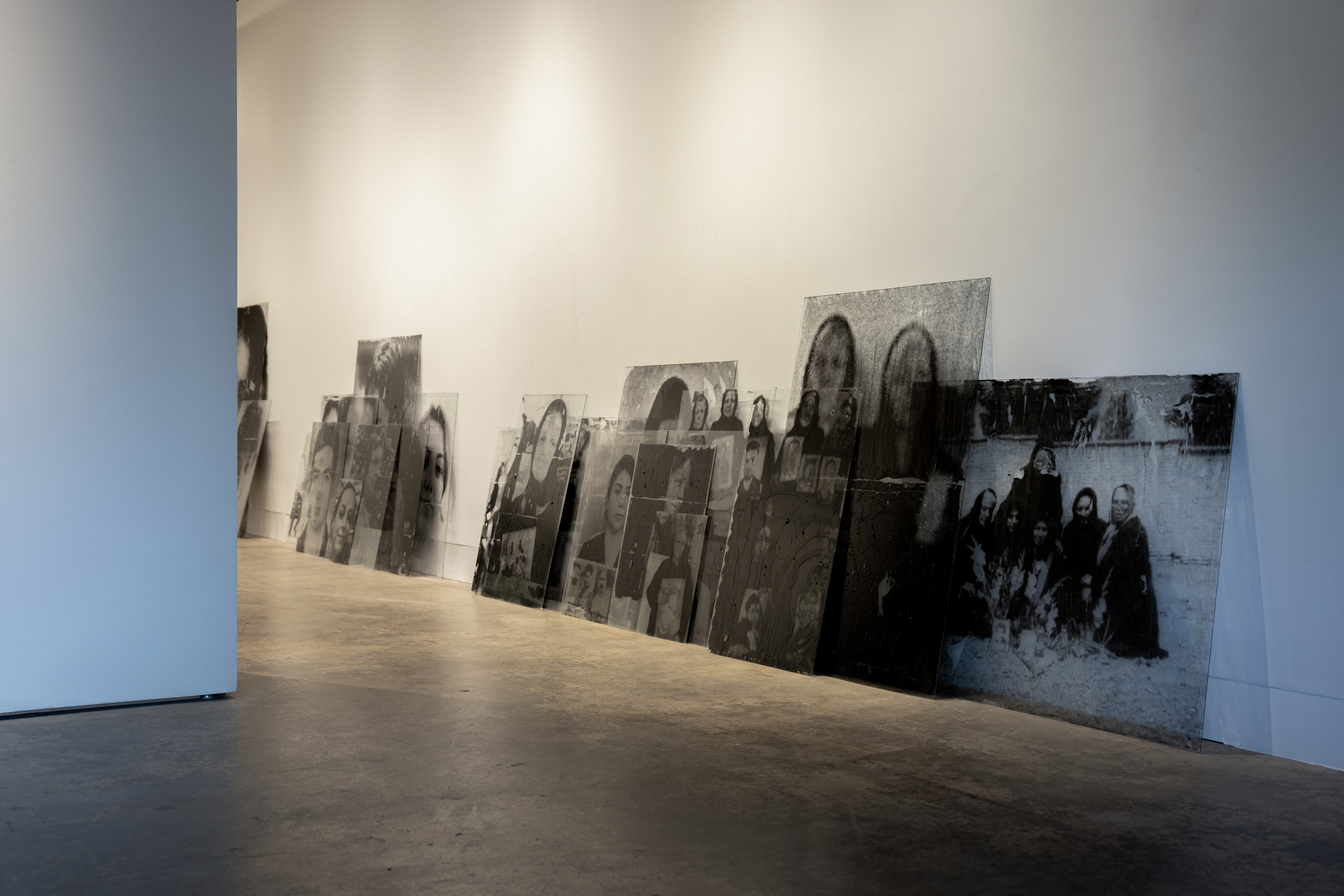 Artwork by Mehrdad Mirzaie leaning up against a wall.
