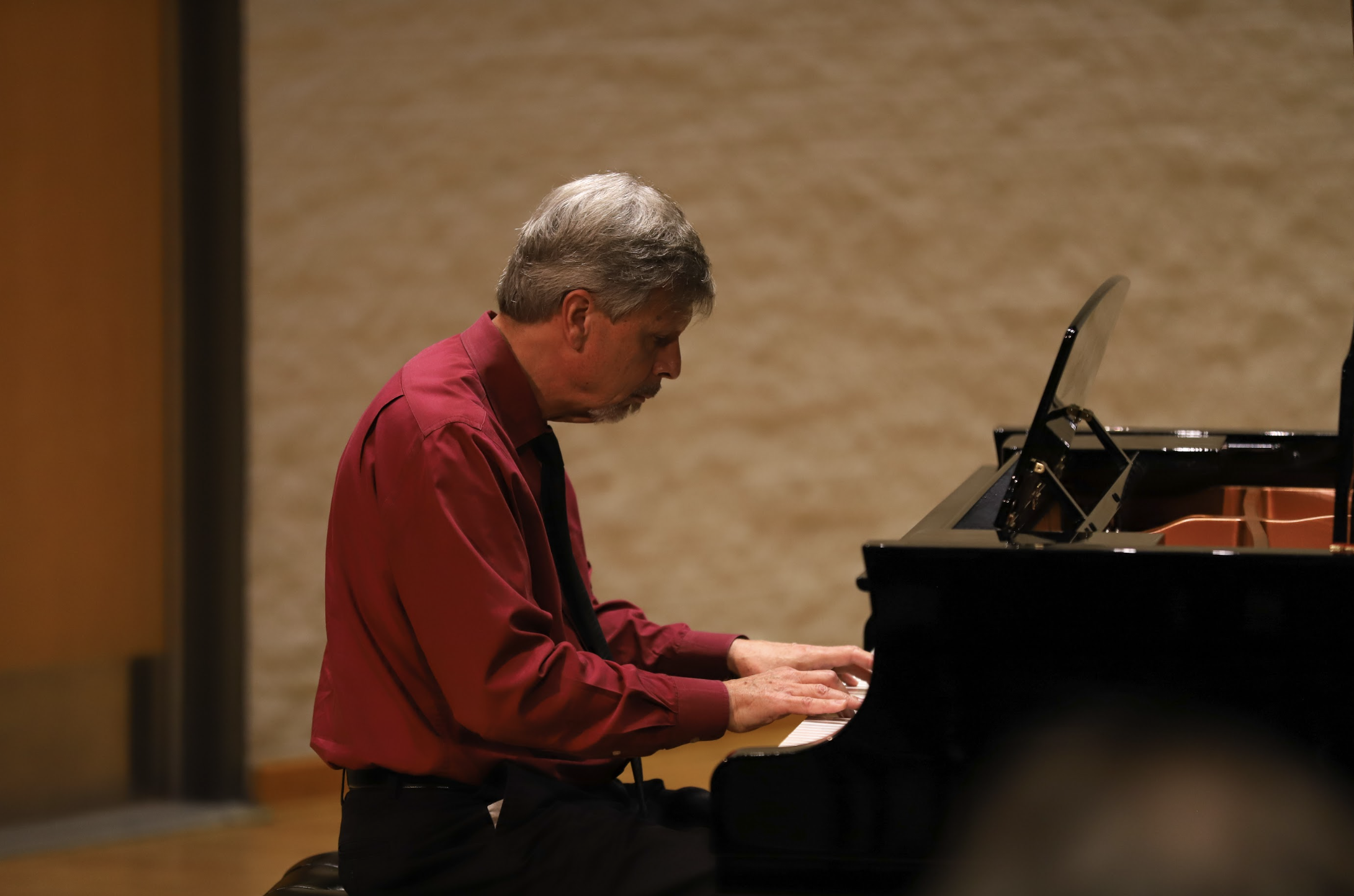Photo of instructor Raymond Ryder playing piano.